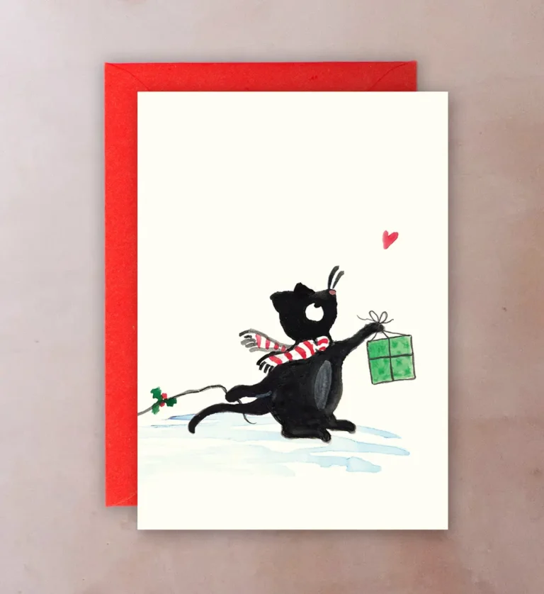 Front of card showing 1950s-style illustration of cat towing red trailer with presents