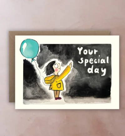 Front of card with illustration of girl in yellow coat holding balloon and pointing to “Your Special Day” text